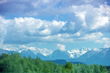 Obraz premium Panoramic view of snow mountain range landscape with blue cloudy sky. Beautiful nature Italy