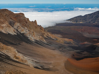 Fototapeta na wymiar Clouds creeping up the valley in Haleakala National Park, Maui, Hawaii.
