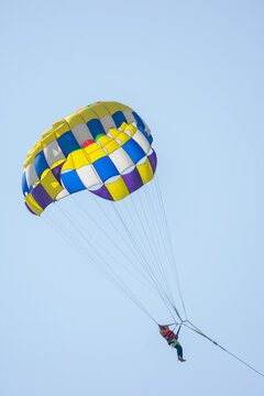 Parasailing in the blue sky of Cox's Bazar