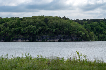 Beautiful scene at the lake in Oklahoma with green trees and blue skies.