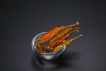 Marinated chilli pepper in the bowl