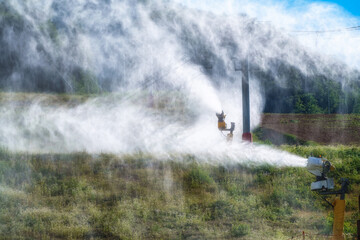 The snow gun on the hillside works in the summer for prevention.