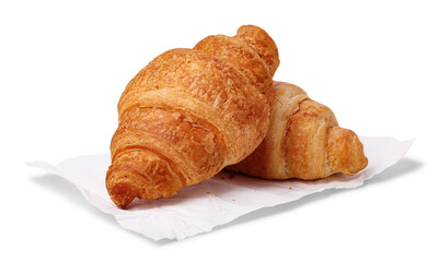 Freshly croissants on white paper isolated on white background. Baking concept.