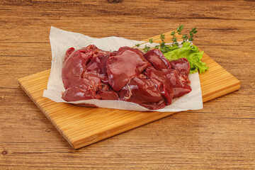 Raw chicken liver over board