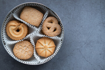 Danish cookies in a box on concrete background.  Top view. Close up view. Copy space.