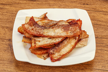 Roasted juicy bacon in the plate