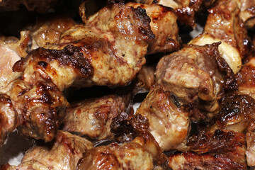 Grilled kebab. Roasted meat with onions. Background from food. Pork