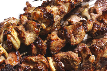 Grilled kebab. Roasted meat with onions. Background from food. Pork
