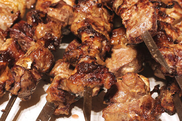 Grilled kebab. Roasted meat with onions. Background from food. Pork
