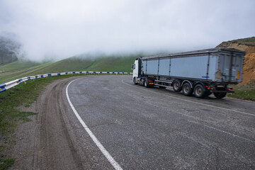 Fototapeta na wymiar truck in road and foggy