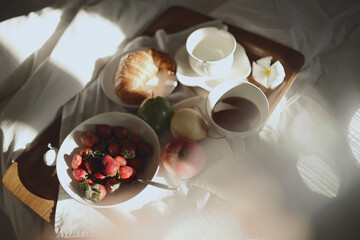 Morning breakfast served in bed at the villa - obrazy, fototapety, plakaty
