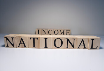 Business concept of national income text with wooden cubes. Close up.