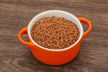 Raw buсkwheat cereal in the bowl