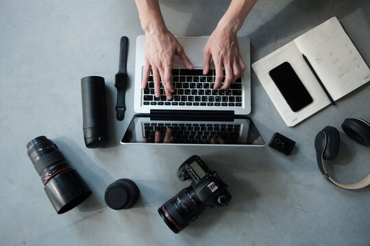 top view of creative photographer using graphic tablet on work table.