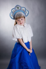 A little girl dressed as Snow Maiden