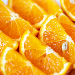 Fototapeta na wymiar juicy orange slices in a row, close-up