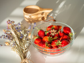 Still life of fresh strawberries tea and lavender