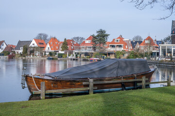 wooden boat on a frozen lake