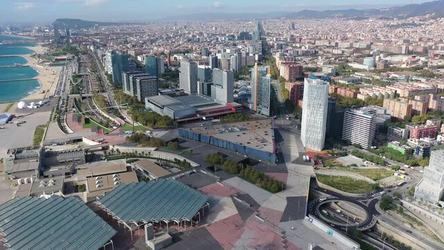 Aerial view of new residential complex of Diagonal Mar i el Front Maritim del Poblenou on sunny fall day, Barcelona, Spain
