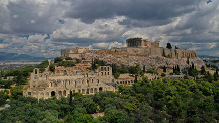 Aerial drone photo of Acropolis of Athens in Attica, Greece, with the Parthenon Temple on top of the hill during a cloudy spring day