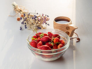Still life of fresh strawberries tea and lavender