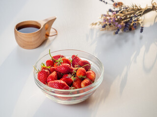 Still life of fresh strawberries tea and lavender