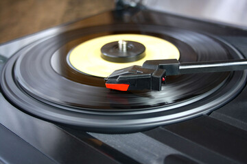 Black record player with vinyl record