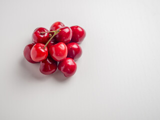 Sweet red cherries on white