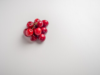 Sweet red cherries on white