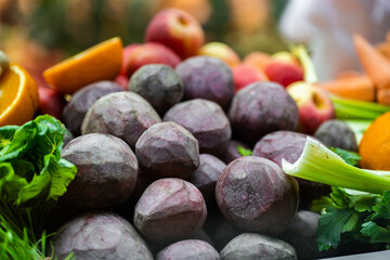 Juice Bar with assorted fresh fruits and vegetables. Tropical summer outdoor background.Various vegetables on the counter. organic fresh fruits and vegetables on grocery counter.Detoxification concept