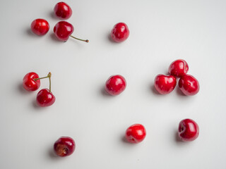 Sweet red cherries on white