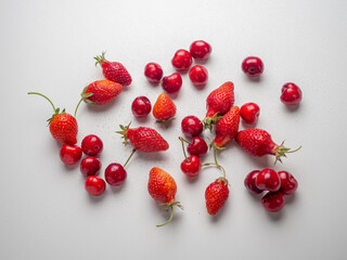 Bright mix of red cherries and strawberries