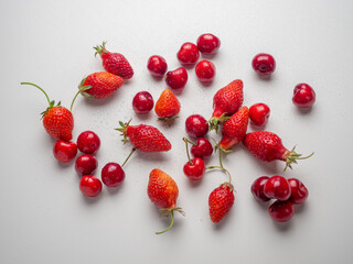 Bright mix of red cherries and strawberries