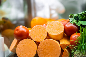 Juice Bar with assorted fresh fruits and vegetables. Tropical summer outdoor background.Various vegetables on the counter. organic fresh fruits and vegetables on grocery counter.Detoxification concept