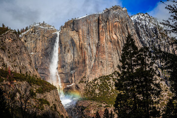 Fototapeta na wymiar Snow and Rainbows on Yosemite Falls, Yosemite National Park, California