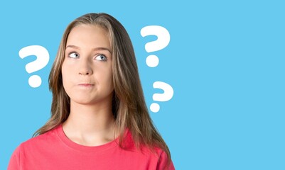 Question sign with a beautiful alarmed woman on pastel background