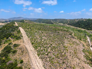 Fototapeta na wymiar Aerial view of of small dry rocky trails in the mountain, San Diego, California, USA