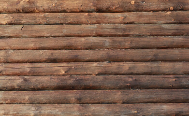 Wooden wall from logs in decline beams