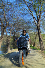 Obraz premium Stylish male model with motorcycle or sports bike