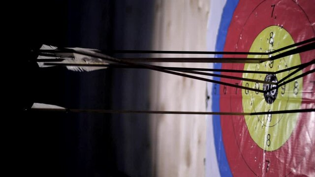 The arrow hits the target. Lots of arrows hit the targets. The arrow hits the target. Accurate archer shooting. Accuracy competition. Targets are hit with an arrow. Archery at a distant target.