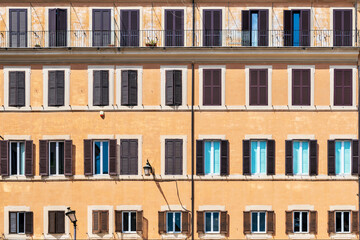Fototapeta na wymiar Buiding wall with windows in Campo de' Fiori in Rome, Italy.
