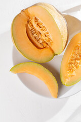 Muskmelon fruit on white background