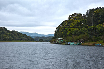 Fototapeta premium Periyar, Thekkady, Kerala/India - September 24, 2013: The double-decker passenger boat (Jalakanyaka) that was capsized in the Thekkady boat disaster occurred on 30 September 2009, was kept on shore.