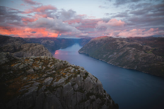 Preikestolen cliff by Lysefjord at sunset in Rogaland, Norway - Powered by Adobe