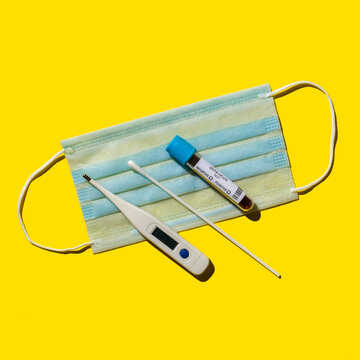 Testing kit for Coronavirus on yellow background
