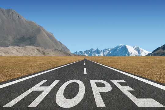 Hope text on highway for motivation concept.