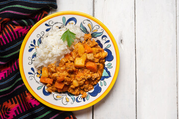 Mexican picadillo with rice on white background