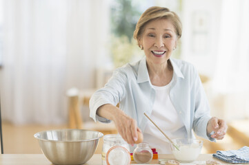 Senior woman cooking in kitchen