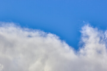 texture of fluffy clouds against a blue sky and fresh air