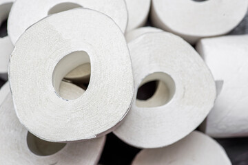 Rolls of toilet paper. Lots of toilet paper rolls.  Soft hygienic paper